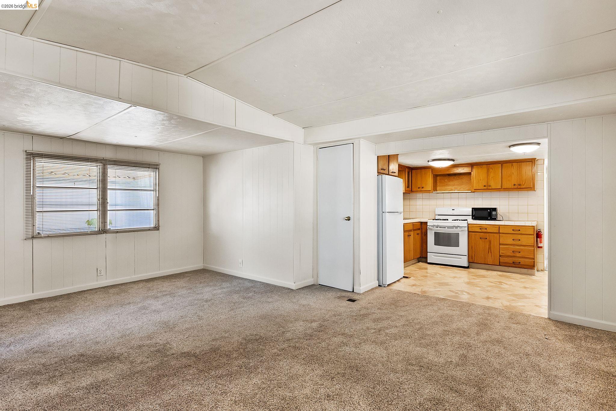 64 Oneida Street Oakley, CA 94561 - Photo 8 of 18 an empty room with a kitchen and a sink