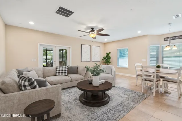 a kitchen with granite countertop a refrigerator and a sink