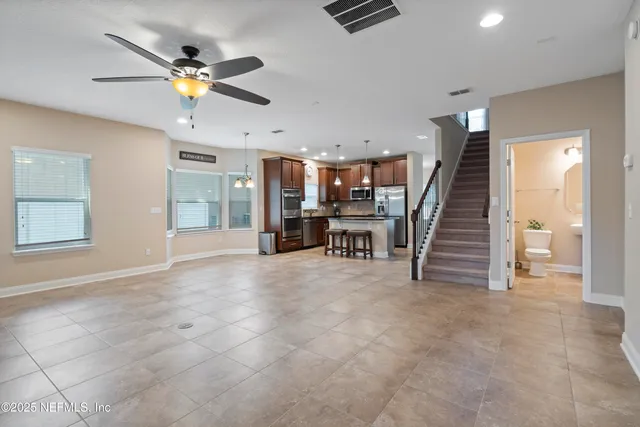 a kitchen with stainless steel appliances granite countertop a sink and cabinets