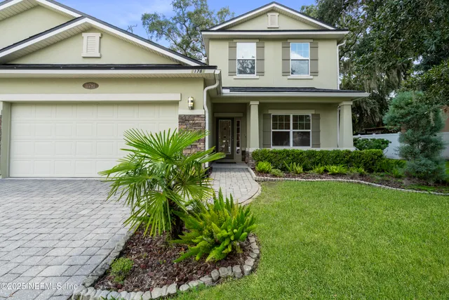 a garden with trees in the background