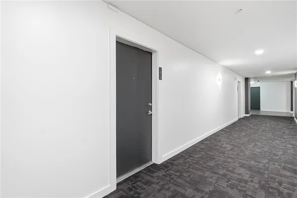 a kitchen with stainless steel appliances granite countertop a sink a stove and cabinets