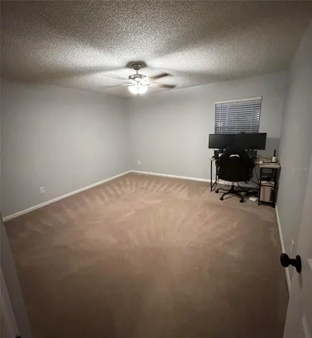 a bathroom with a granite countertop sink and mirror