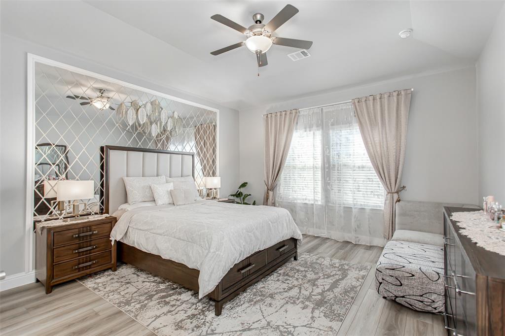2437 Pinnacle Place Corinth, TX 76210 - Photo 19 of 40 a bedroom with a bed and a window