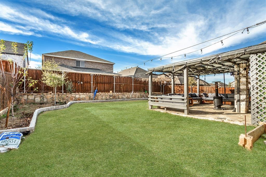 2437 Pinnacle Place Corinth, TX 76210 - Photo 39 of 40 a view of a house with a backyard porch and sitting area