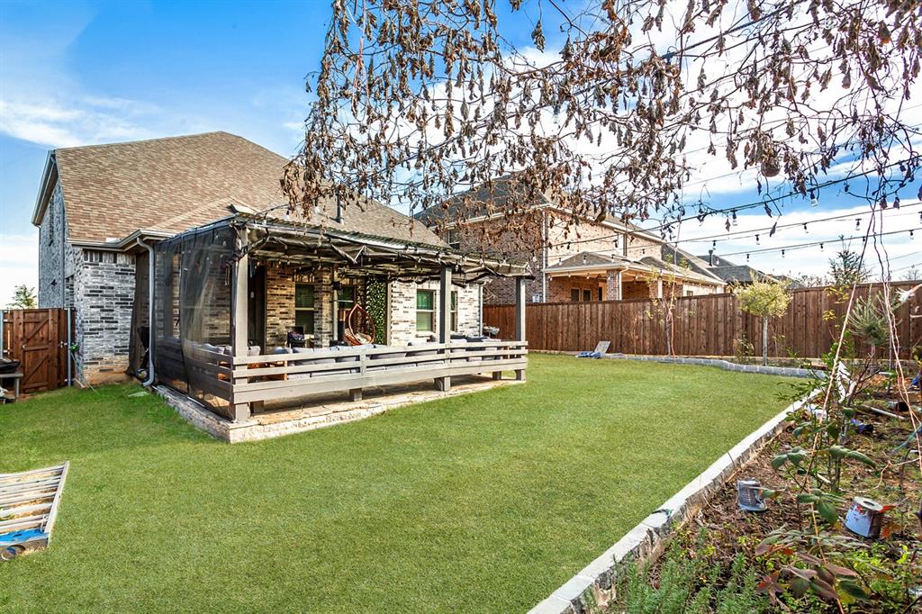 2437 Pinnacle Place Corinth, TX 76210 - Photo 40 of 40 a view of a house with backyard porch and garden