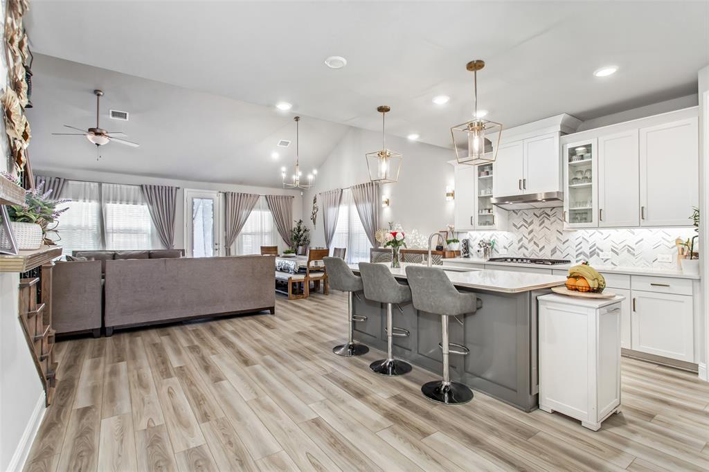 2437 Pinnacle Place Corinth, TX 76210 - Photo 7 of 40 a large kitchen with a table and chairs