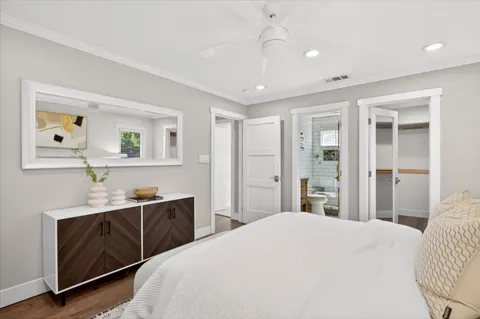 a bedroom with a bed and a dresser