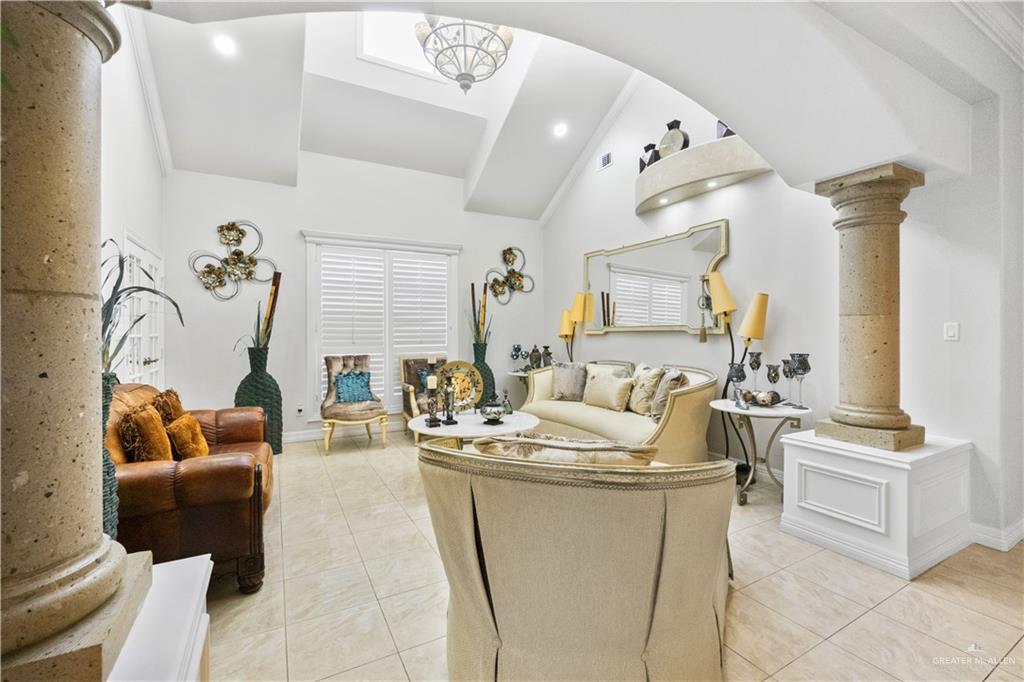 800 East Mile 3 Road Mission, TX 78573 - Photo 14 of 45 a living room with furniture and a chandelier