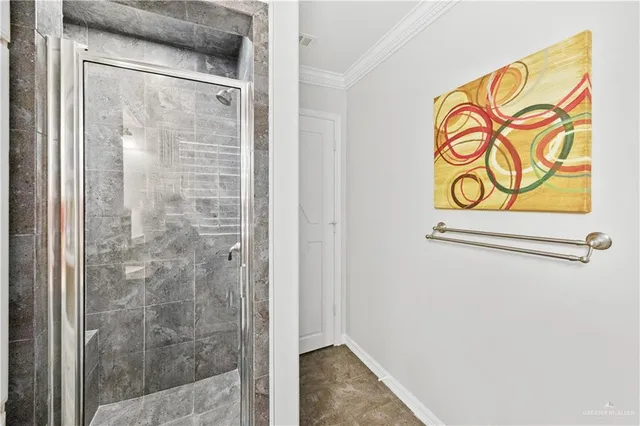 a bedroom with furniture a flat screen tv and a fireplace