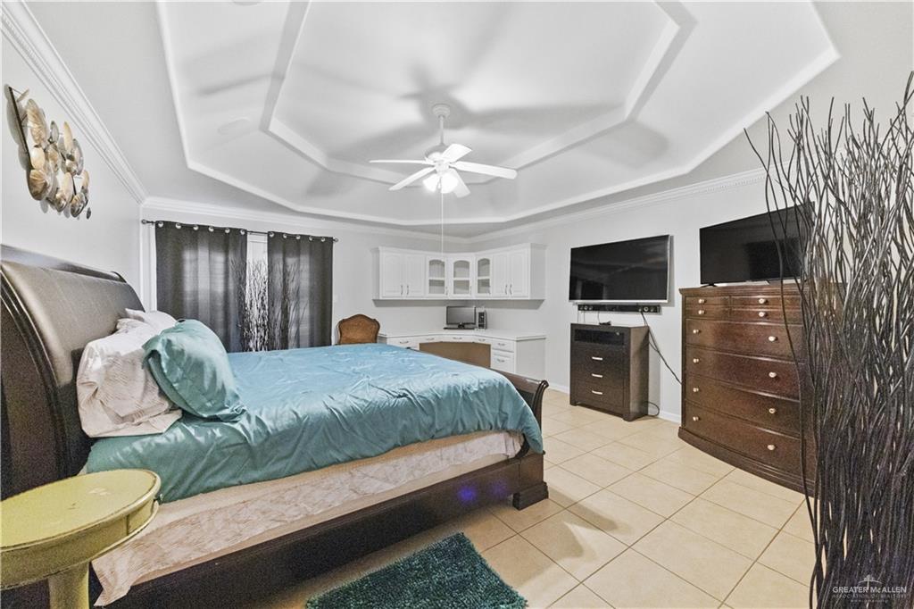 800 East Mile 3 Road Mission, TX 78573 - Photo 37 of 45 a living room with furniture and a flat screen tv