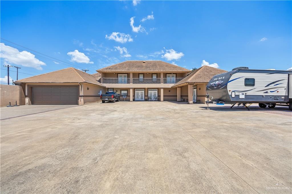 800 East Mile 3 Road Mission, TX 78573 - Photo 39 of 45 a front view of a house with a yard