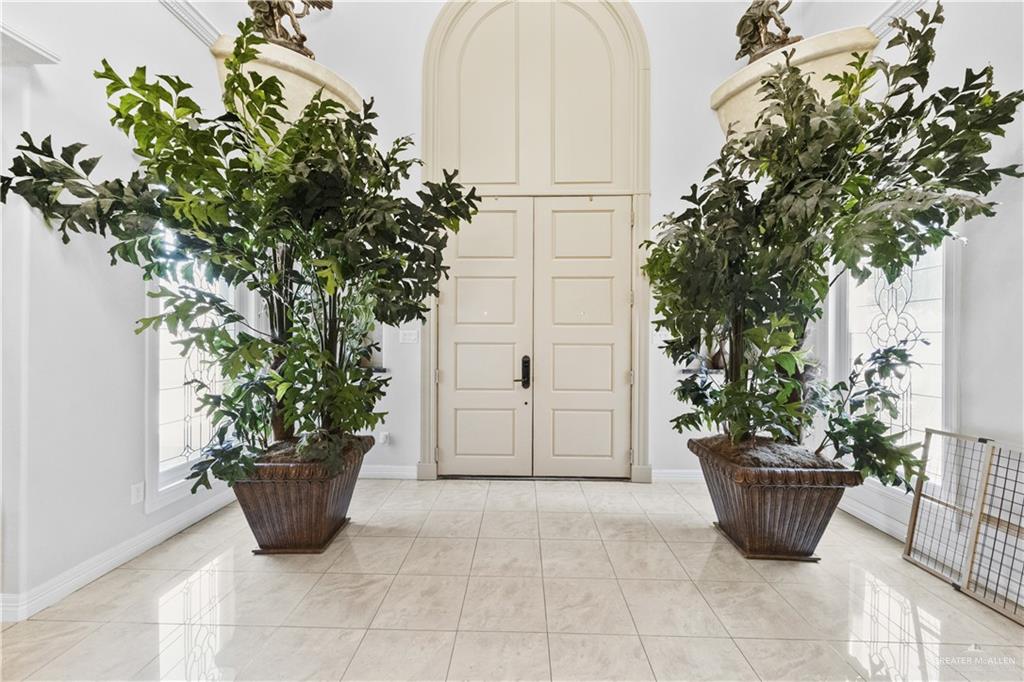 800 East Mile 3 Road Mission, TX 78573 - Photo 4 of 45 a view of a entryway with potted plants