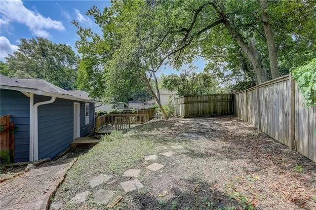 a backyard of a house with lots of green space