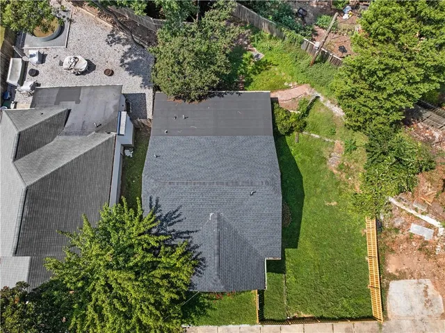 an aerial view of a house with outdoor space