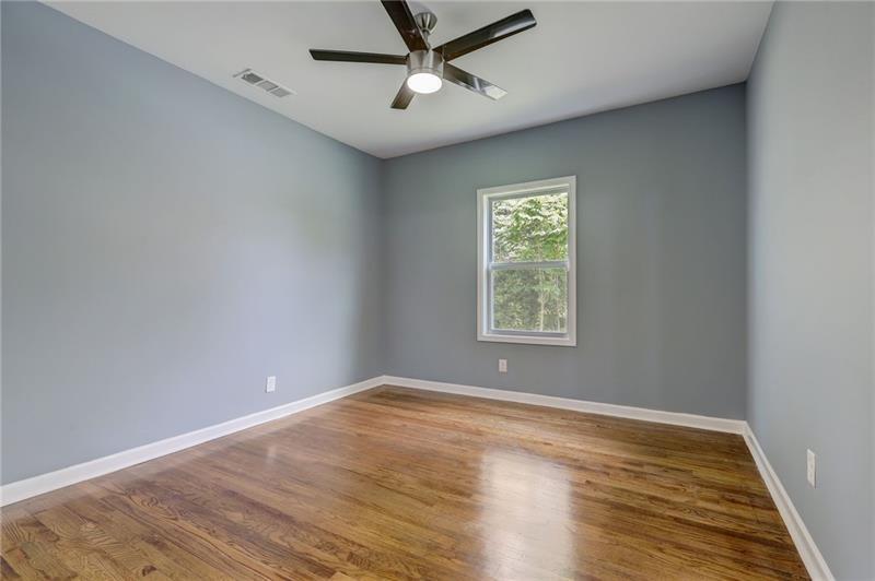 807 Gilbert Street Southeast Atlanta, GA 30316 - Photo 9 of 23 wooden floor in an empty room with a window
