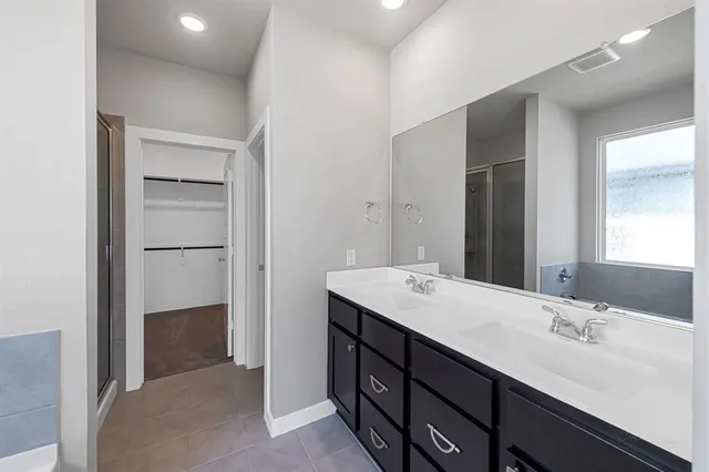 a white bath tub sitting next to a window