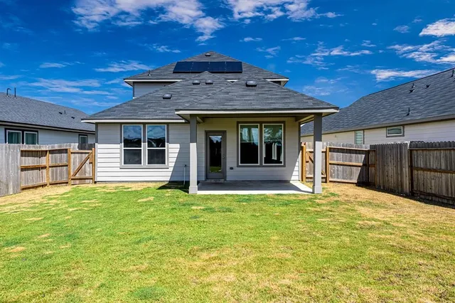 a bathroom with a shower and a sink