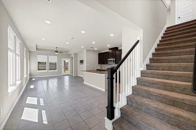a view of entryway with wooden floor and staircase