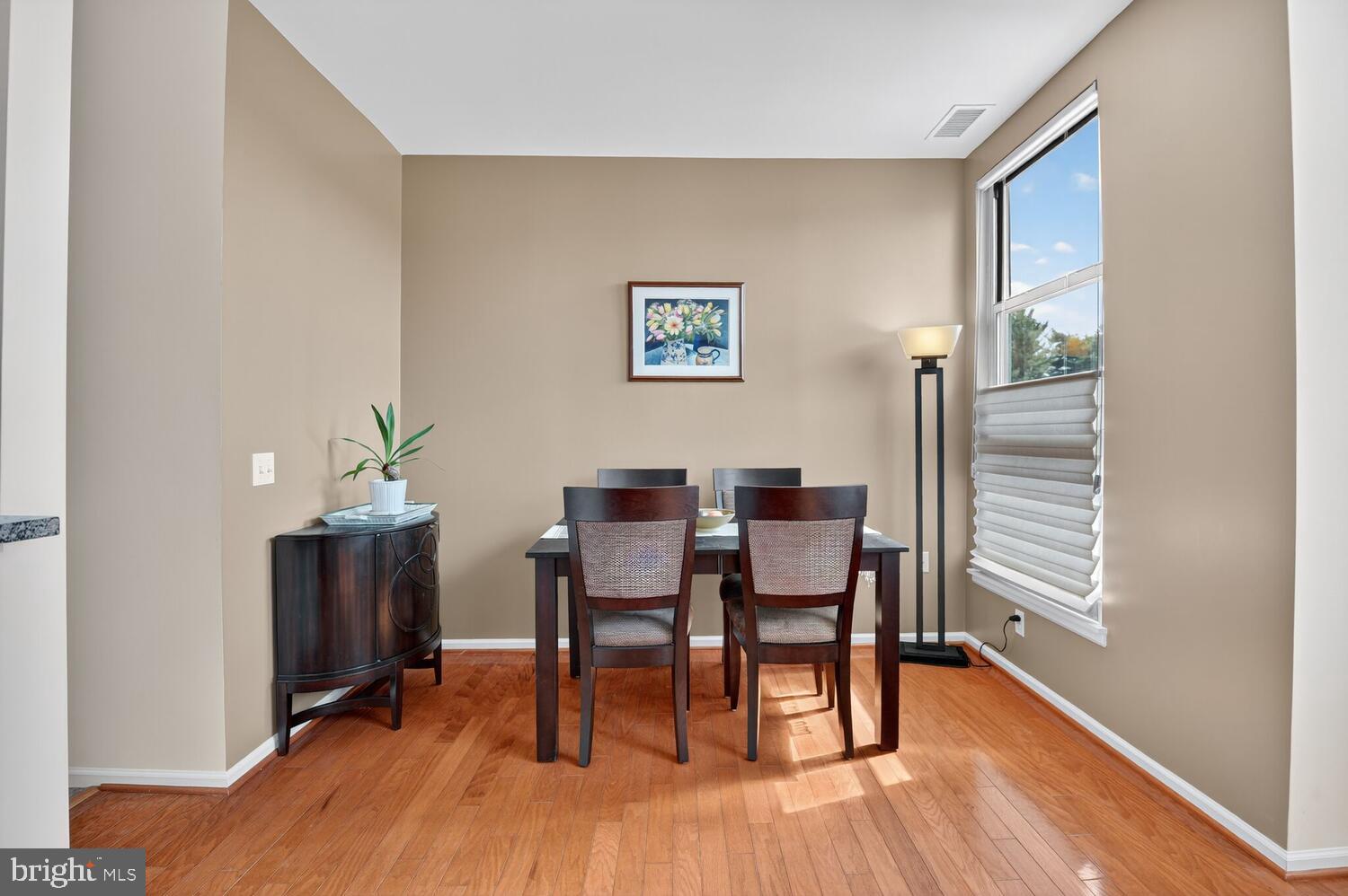 343 Cedar Street Northwest, Unit 322 Washington, DC 20012 - Photo 16 of 40 a view of a dining room with furniture and wooden floor