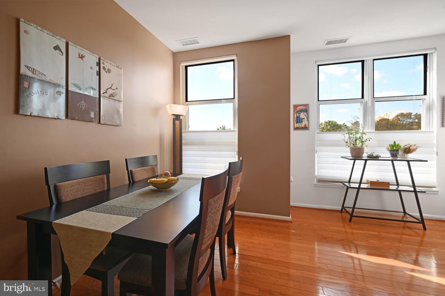 343 Cedar Street Northwest, Unit 322 Washington, DC 20012 - Photo 17 of 40 a view of a dining room with furniture and a large window