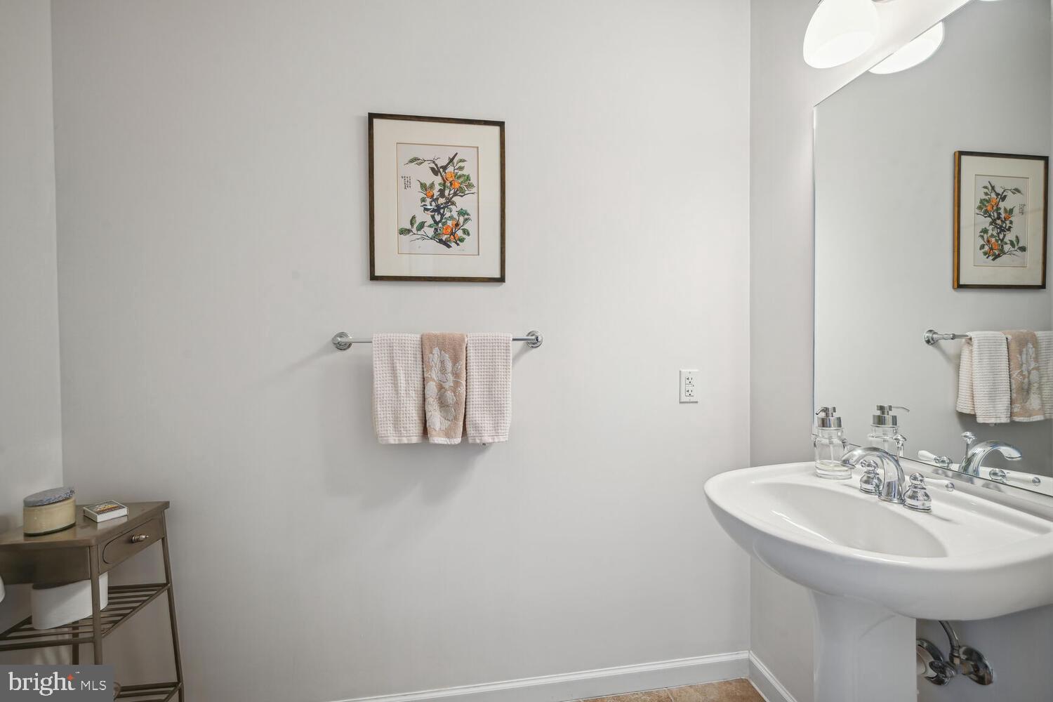 343 Cedar Street Northwest, Unit 322 Washington, DC 20012 - Photo 19 of 40 a bathroom with a sink mirror and toilet