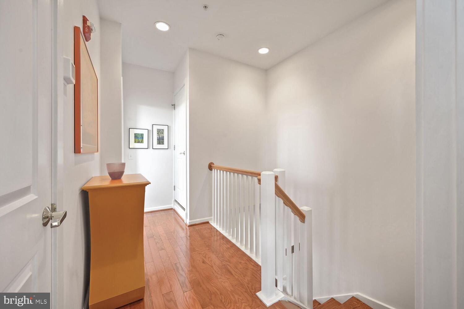 343 Cedar Street Northwest, Unit 322 Washington, DC 20012 - Photo 21 of 40 a view of a hallway with windows and stairs