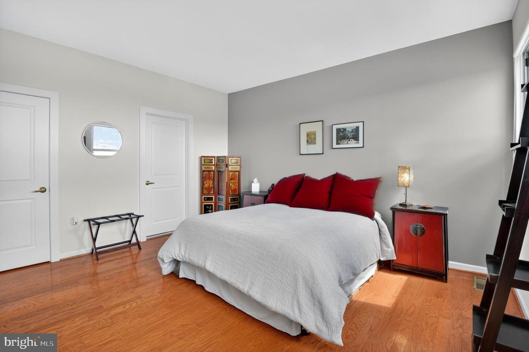 343 Cedar Street Northwest, Unit 322 Washington, DC 20012 - Photo 22 of 40 a bedroom with a bed and a table