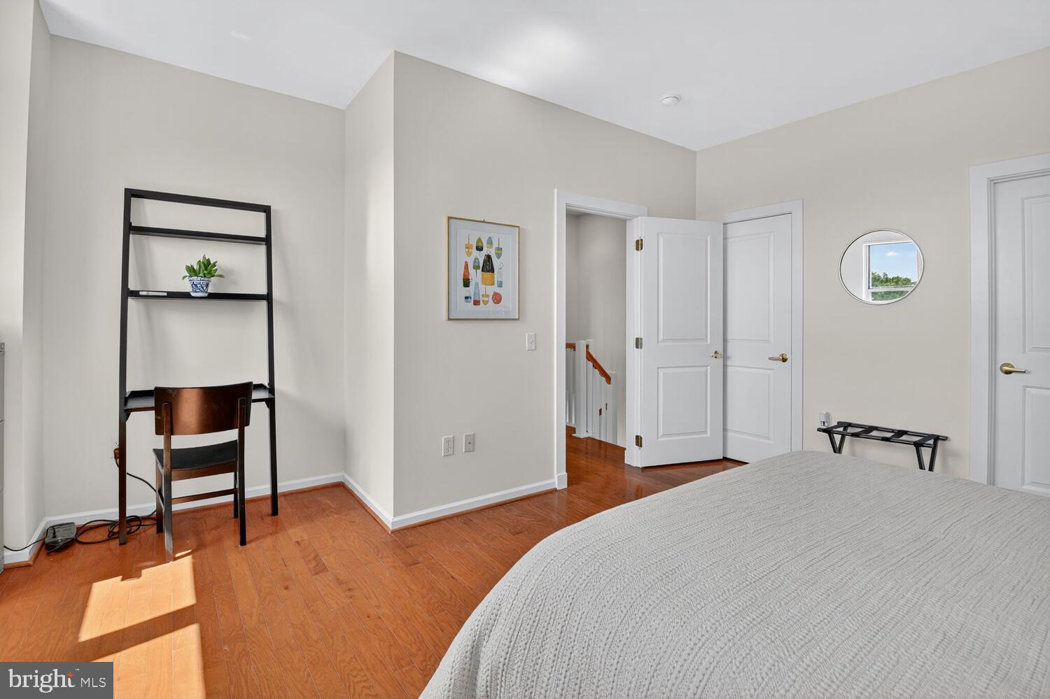 343 Cedar Street Northwest, Unit 322 Washington, DC 20012 - Photo 24 of 40 a bedroom with a bed and a workspace