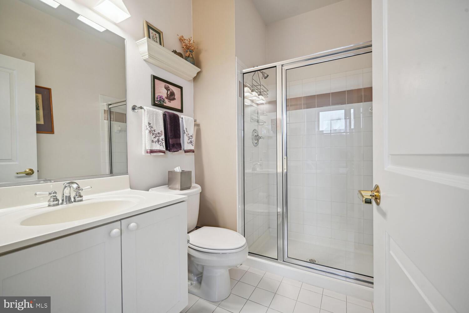 343 Cedar Street Northwest, Unit 322 Washington, DC 20012 - Photo 31 of 40 a bathroom with a toilet sink and shower