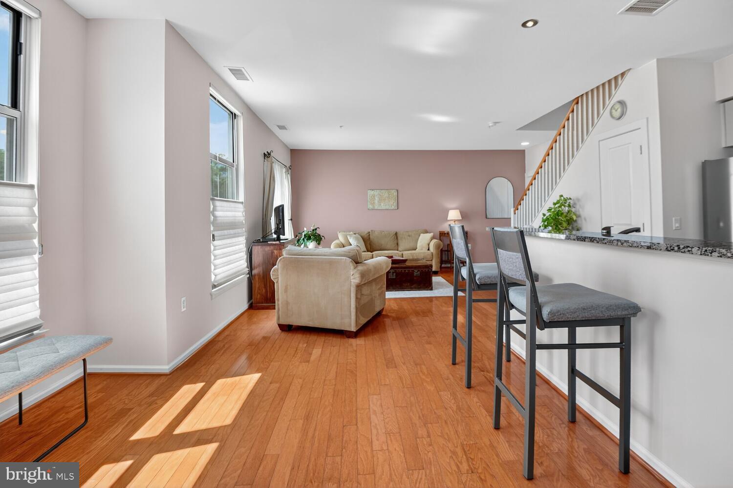 343 Cedar Street Northwest, Unit 322 Washington, DC 20012 - Photo 10 of 40 a living room with furniture and a wooden floor