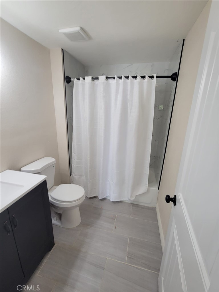 140 North 4th Street Colton, CA 92324 - Photo 13 of 22 a bathroom with a toilet and shower