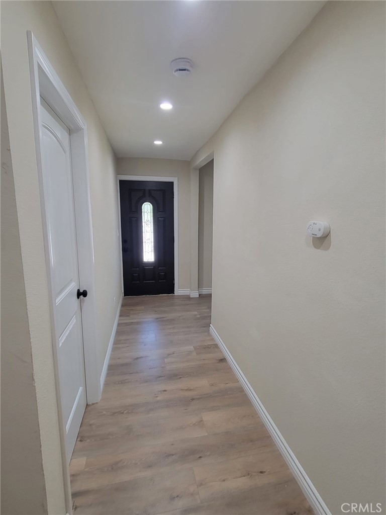 140 North 4th Street Colton, CA 92324 - Photo 9 of 22 a view of empty room with wooden floor