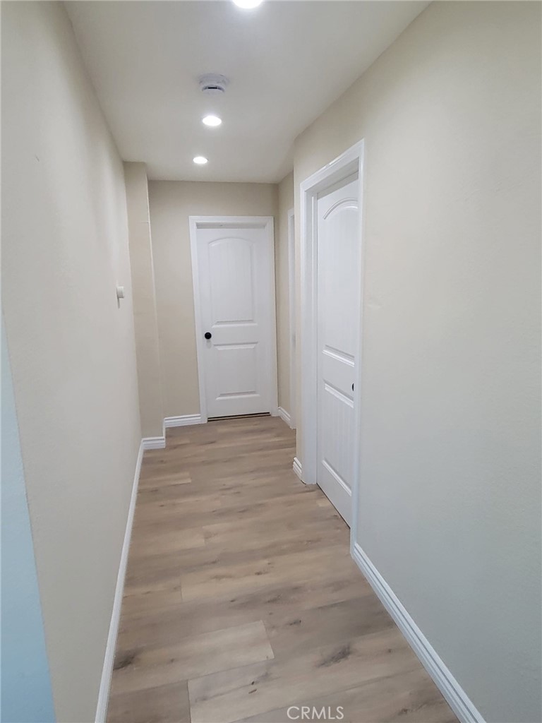140 North 4th Street Colton, CA 92324 - Photo 10 of 22 a view of a hallway with wooden floor