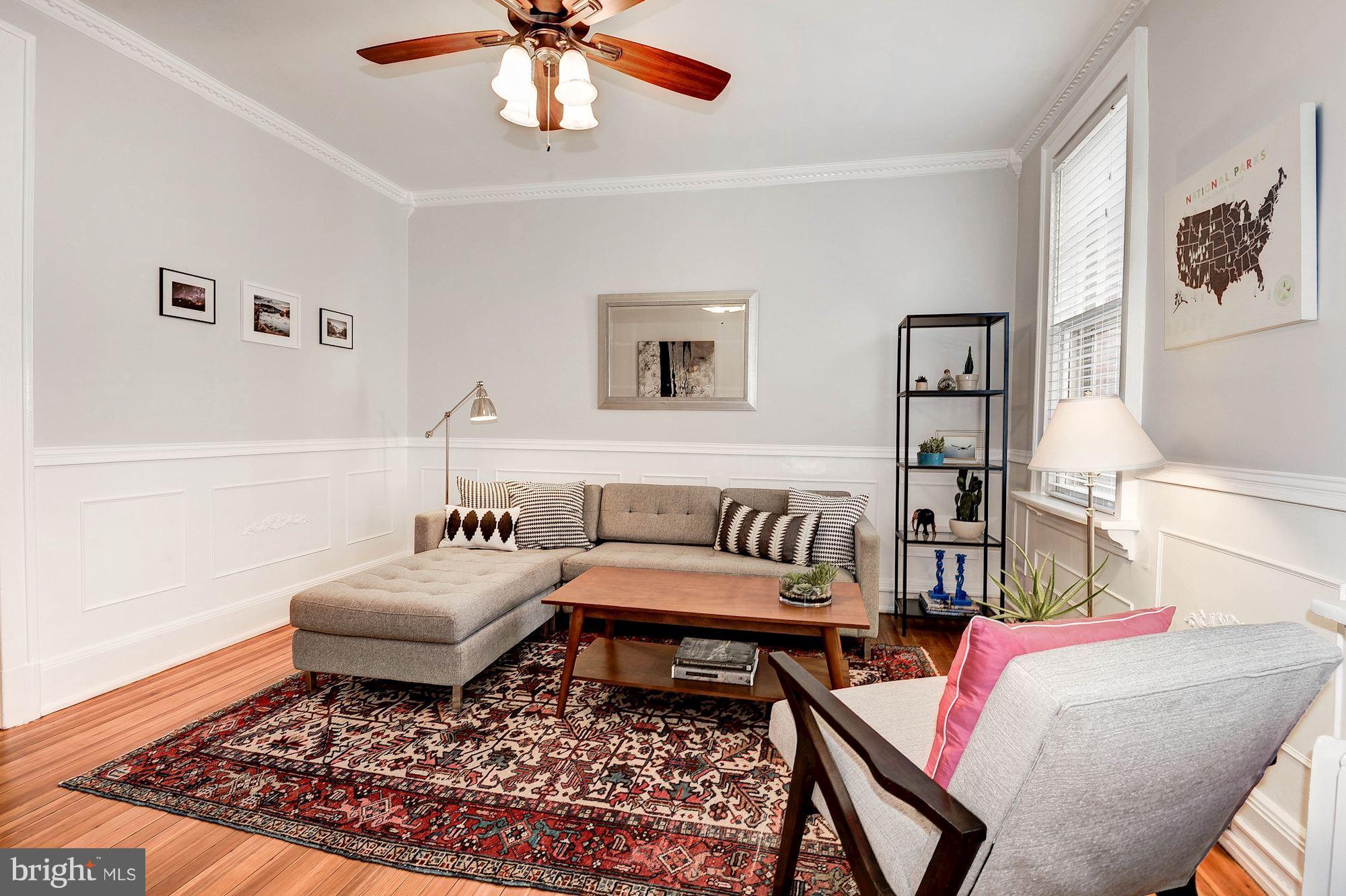 516 A Street Northeast, Unit 205 Washington, DC 20002 - Photo 2 of 21 a living room with furniture and a rug