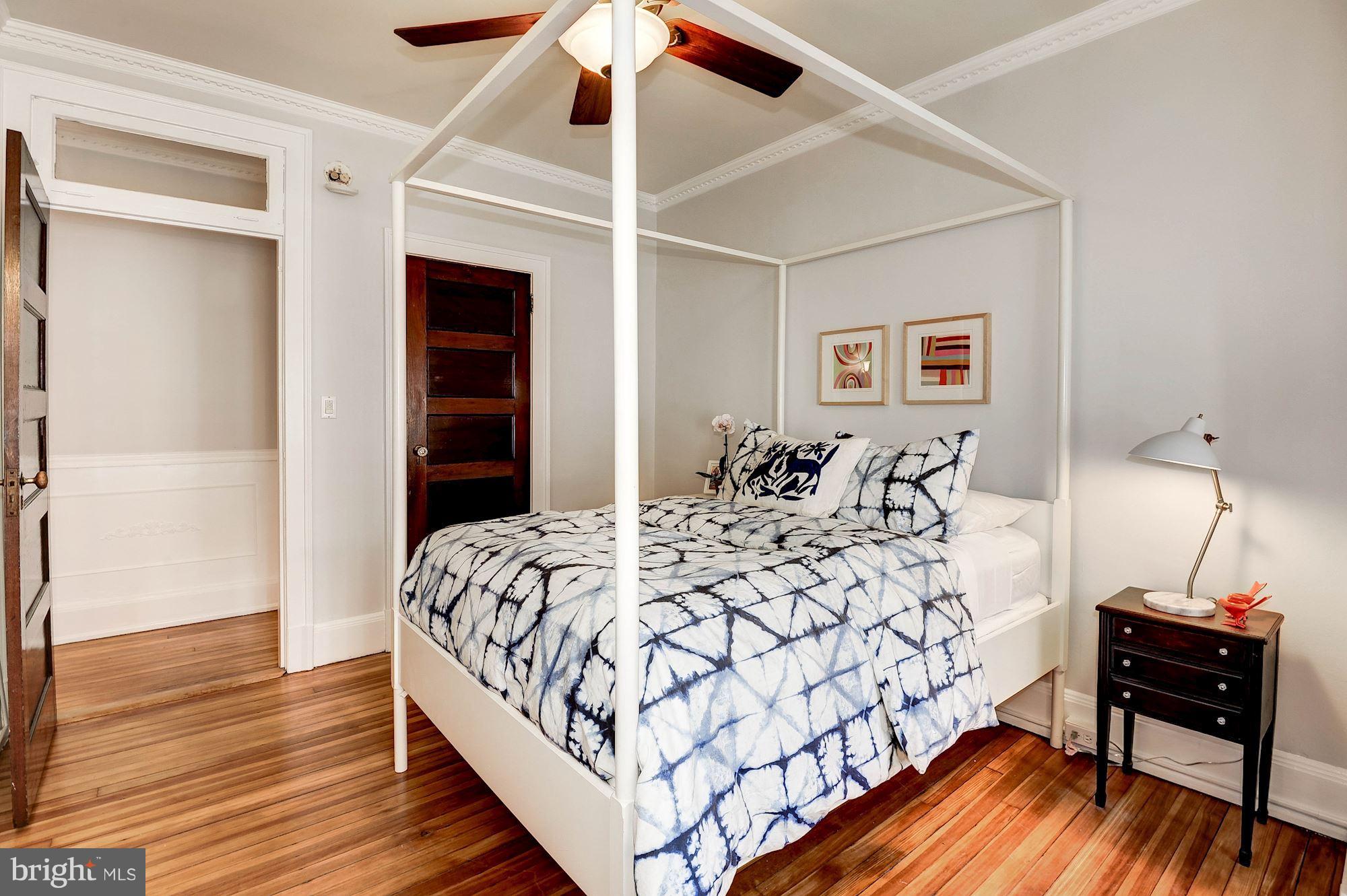 516 A Street Northeast, Unit 205 Washington, DC 20002 - Photo 15 of 21 a bedroom with a bed and wooden floor