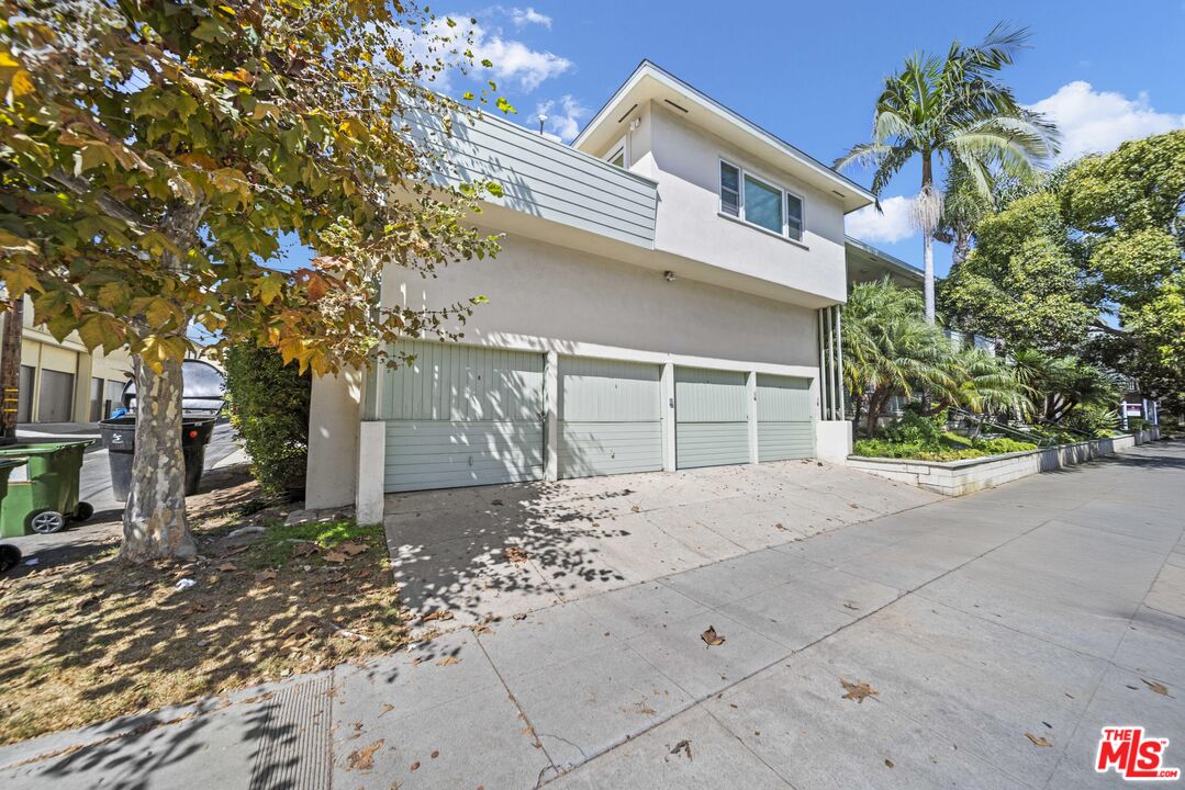 1325 Washington Avenue, Unit C Santa Monica, CA 90403 - Photo 16 of 23 a front view of a house with a yard and garage