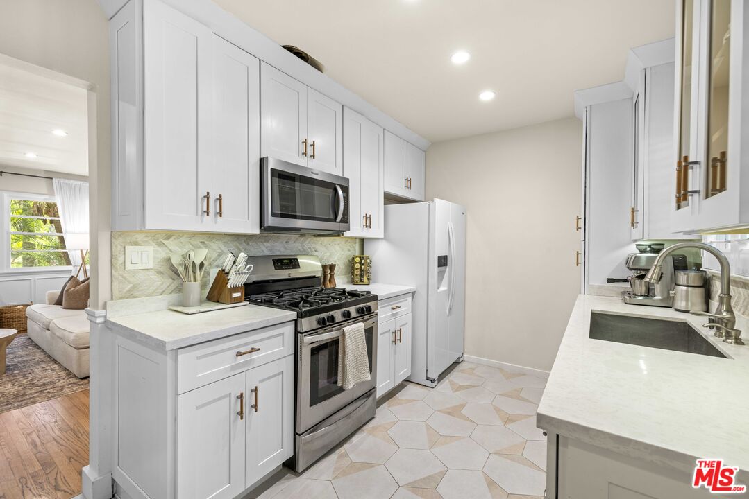 1325 Washington Avenue, Unit C Santa Monica, CA 90403 - Photo 5 of 23 a kitchen with a sink stove and refrigerator