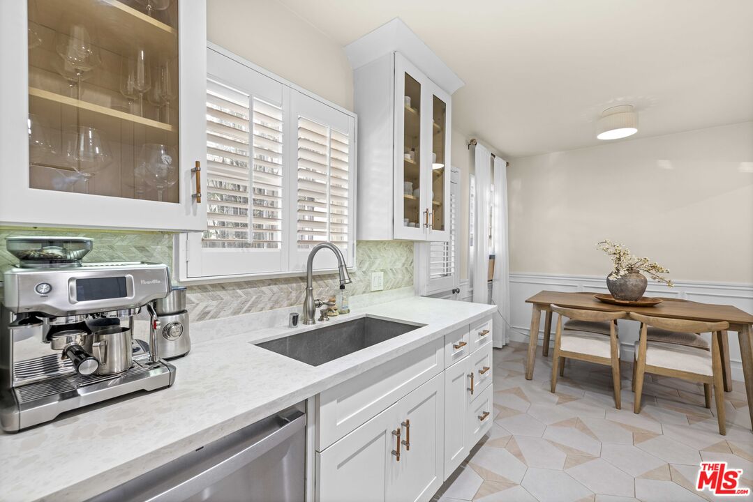 1325 Washington Avenue, Unit C Santa Monica, CA 90403 - Photo 7 of 23 a kitchen with a sink cabinets and window