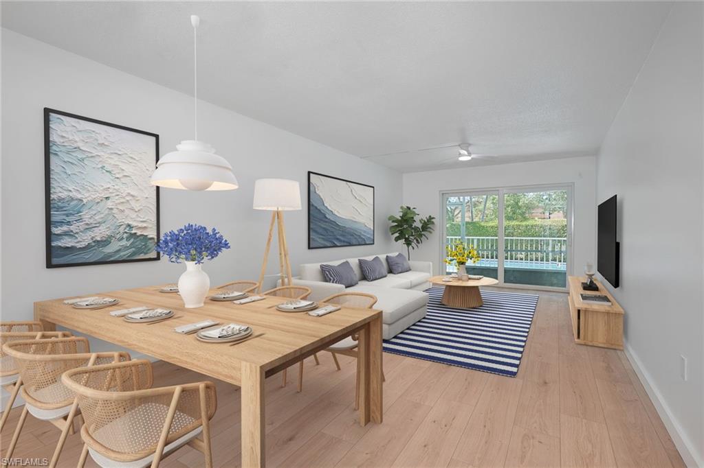 72 7th Street South, Unit 108 Naples, FL 34102 - Photo 2 of 22 a outdoor space with furniture and wooden floor