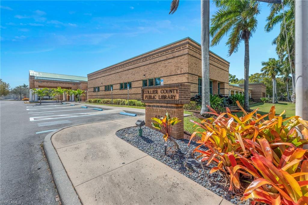 72 7th Street South, Unit 108 Naples, FL 34102 - Photo 22 of 22 front view of house with a yard