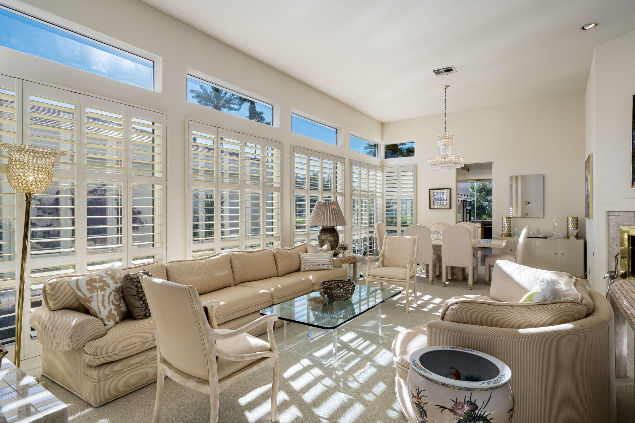 75315 St Andrews Court Indian Wells, CA 92210 - Photo 11 of 48 a living room with furniture and a large window