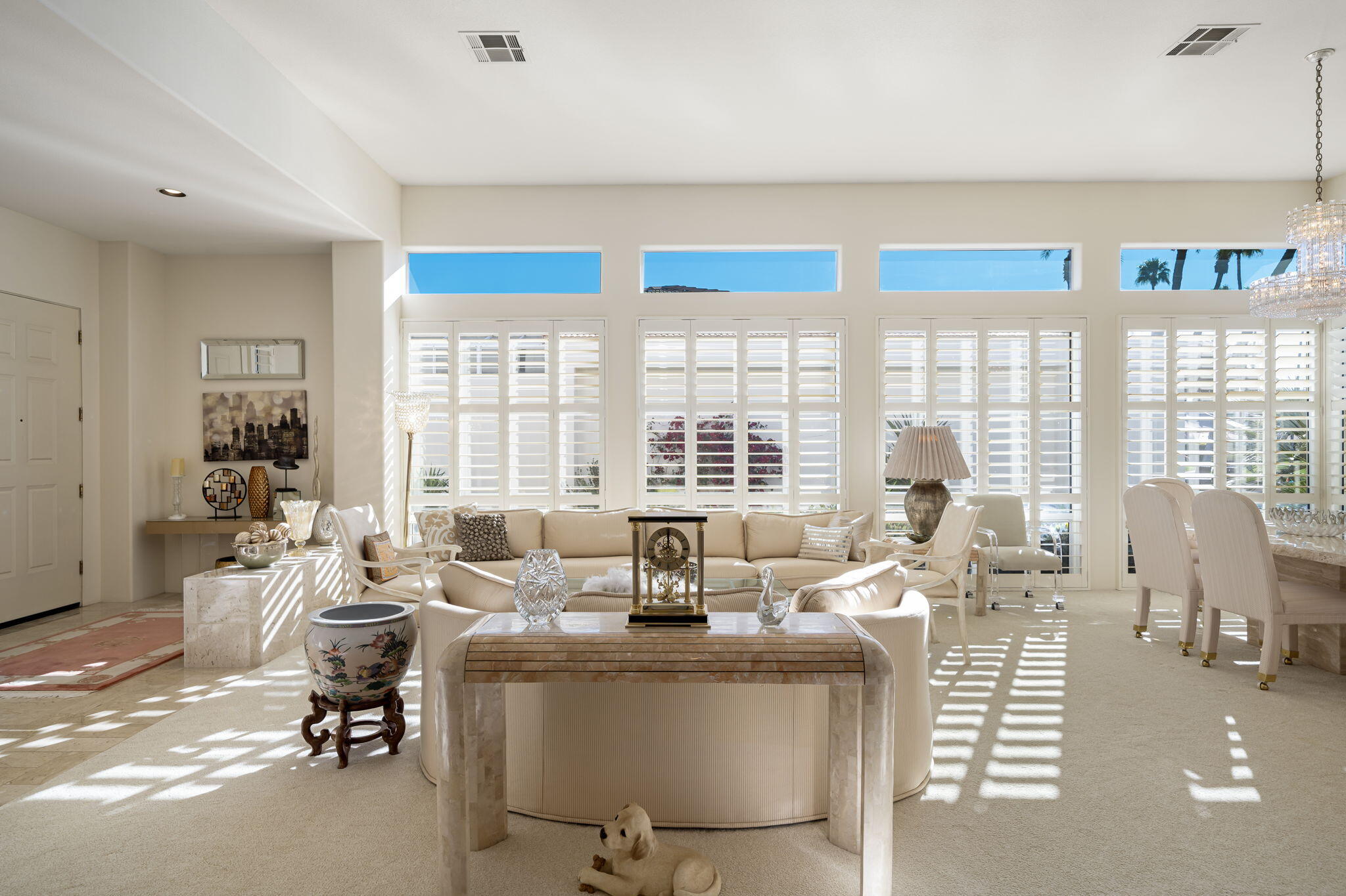 75315 St Andrews Court Indian Wells, CA 92210 - Photo 13 of 48 a living room with furniture large window and chairs