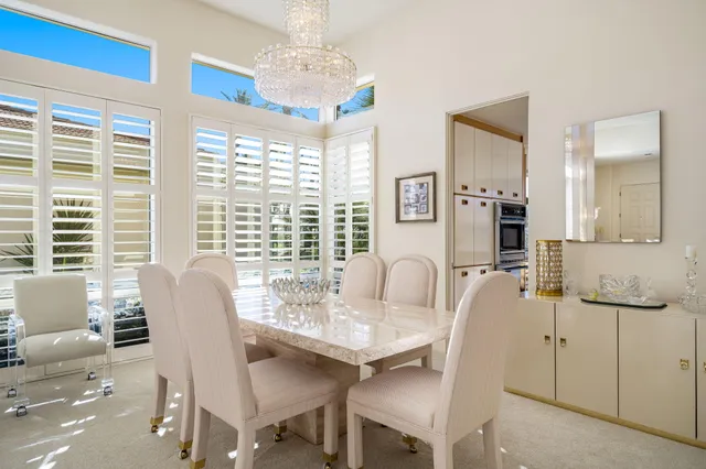 a view of a dining room with furniture window and outside view