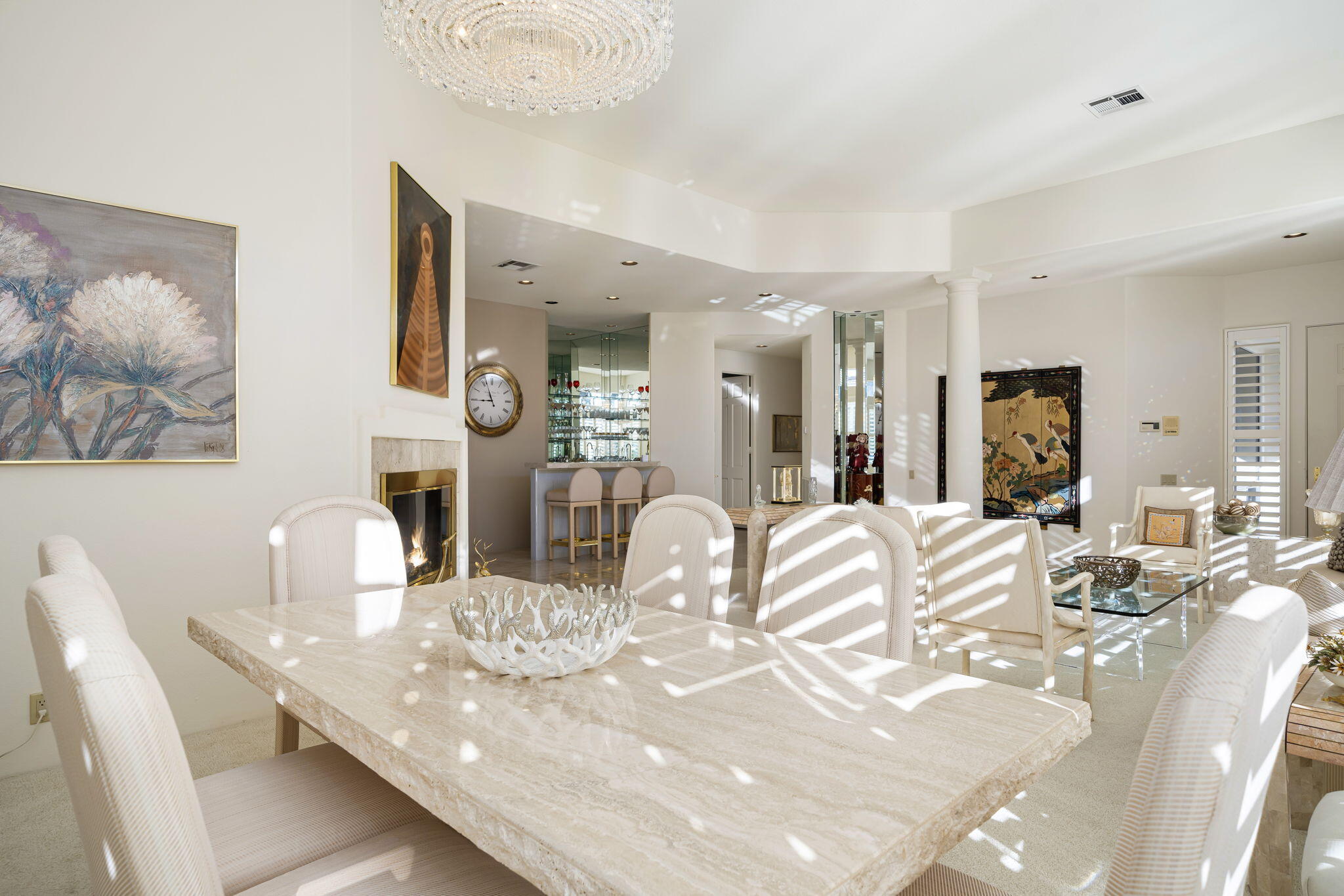 75315 St Andrews Court Indian Wells, CA 92210 - Photo 16 of 48 a view of a dining room with furniture and a large mirror
