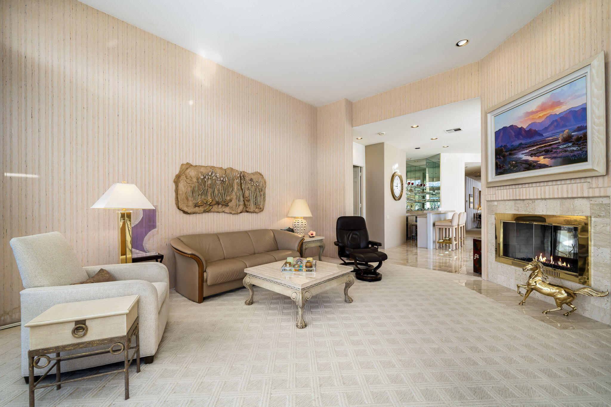 75315 St Andrews Court Indian Wells, CA 92210 - Photo 20 of 48 a living room with furniture a fireplace and a flat screen tv