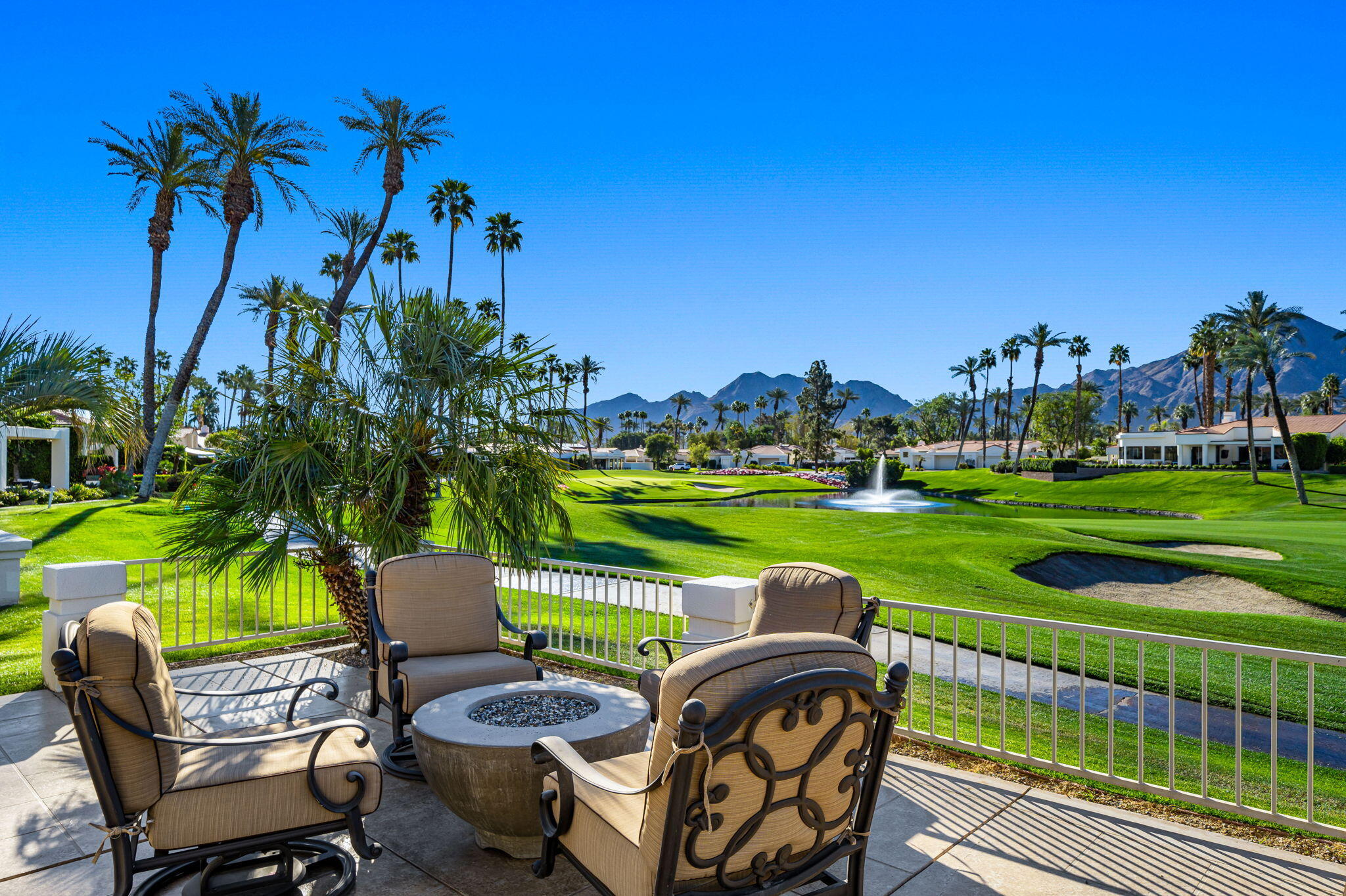 75315 St Andrews Court Indian Wells, CA 92210 - Photo 2 of 48 a view of a swimming pool and outdoor seating