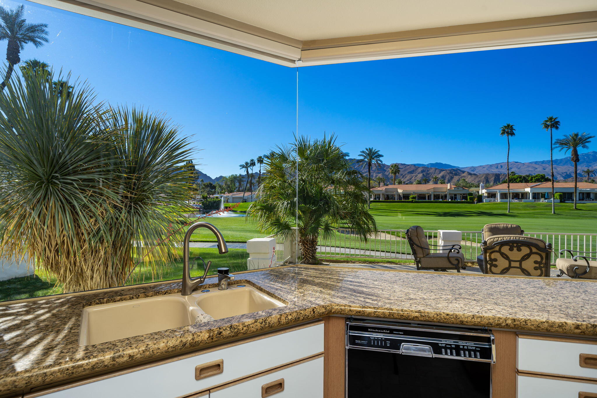 75315 St Andrews Court Indian Wells, CA 92210 - Photo 23 of 48 a kitchen with a table and chairs