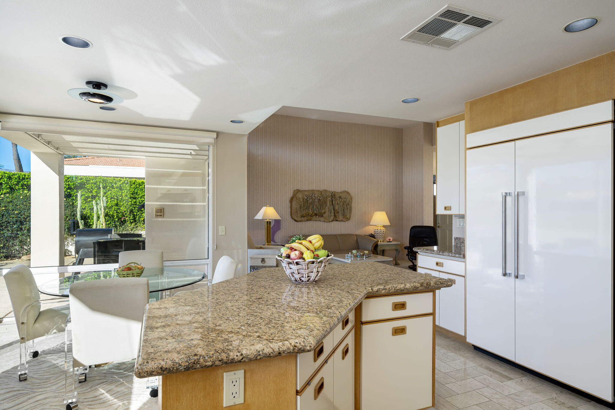 75315 St Andrews Court Indian Wells, CA 92210 - Photo 24 of 48 a kitchen with stainless steel appliances granite countertop sink refrigerator and microwave
