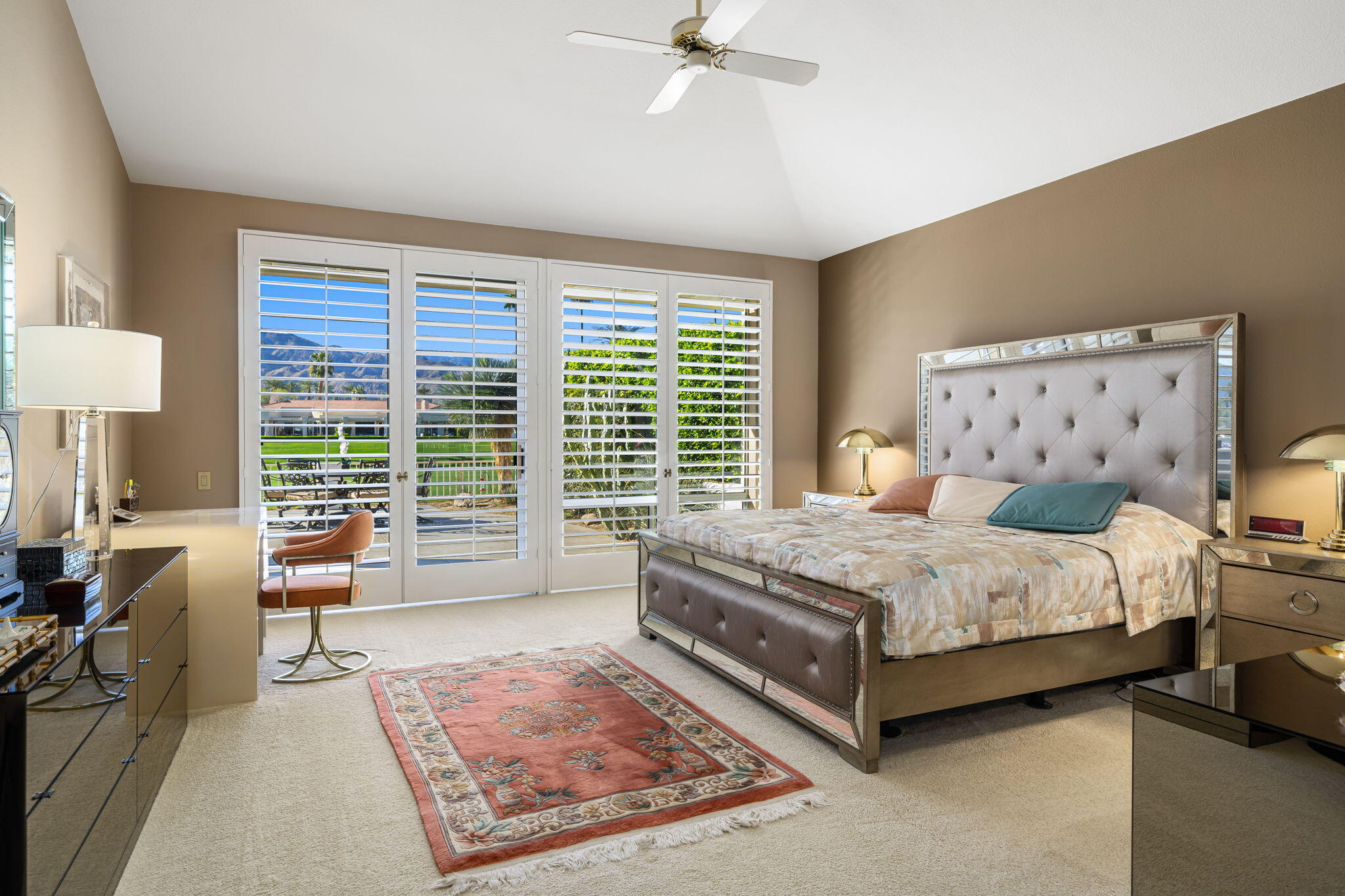 75315 St Andrews Court Indian Wells, CA 92210 - Photo 27 of 48 a bedroom with a bed wooden floor and lamp