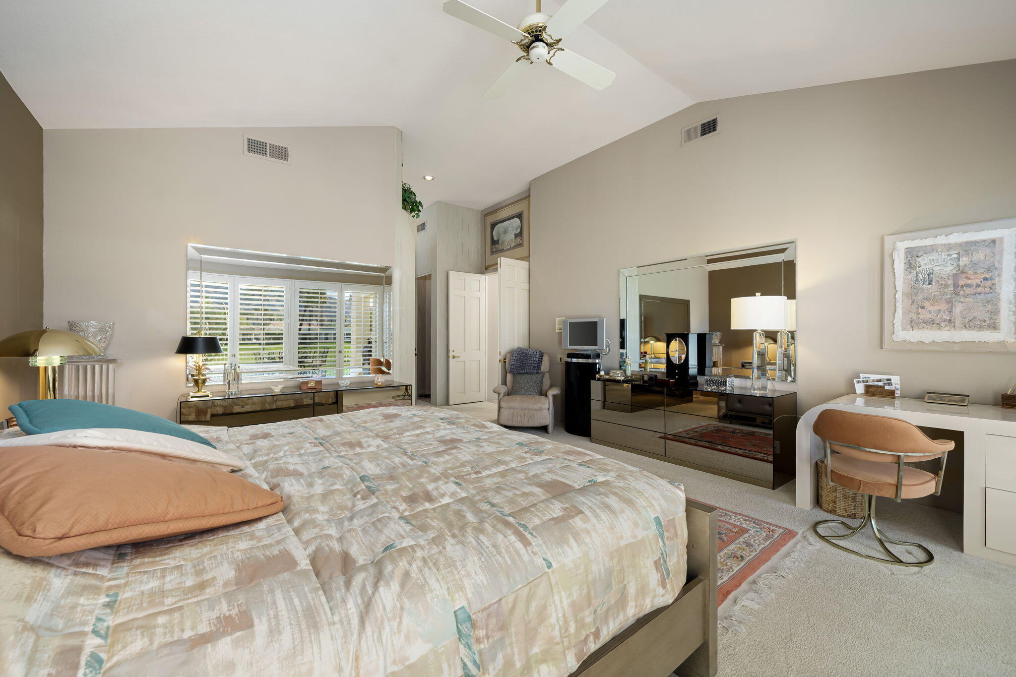 75315 St Andrews Court Indian Wells, CA 92210 - Photo 28 of 48 a bedroom with furniture and a large mirror